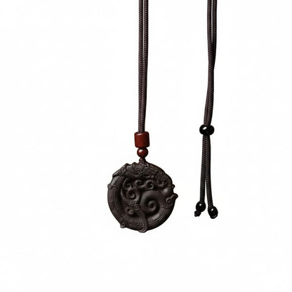 The Coiling Dragon Amulet by Zhiji, a symbol of unleashing one's latent power and inner authority, handcrafted in a traditional Eastern style.