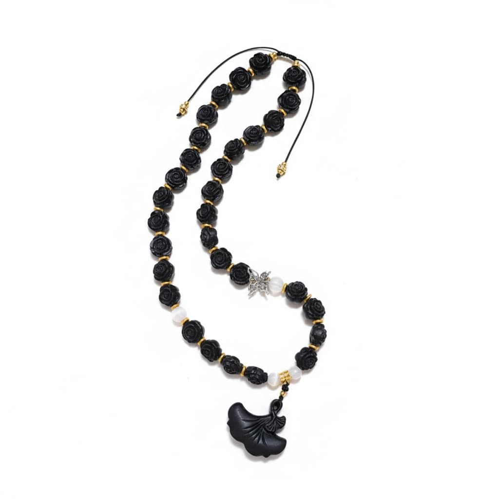 The Midnight Bloom Necklace by Zhiji, a personalized wellness companion with handcrafted rose beads, designed to support your inner spirit and energy flow.