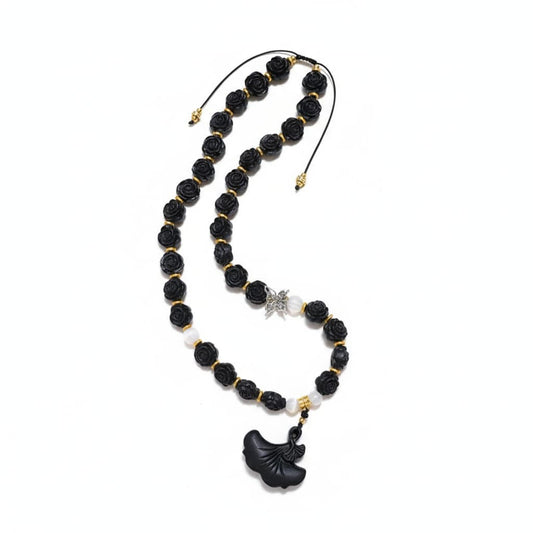 The Midnight Bloom Necklace by Zhiji, a personalized wellness companion with handcrafted rose beads, designed to support your inner spirit and energy flow.