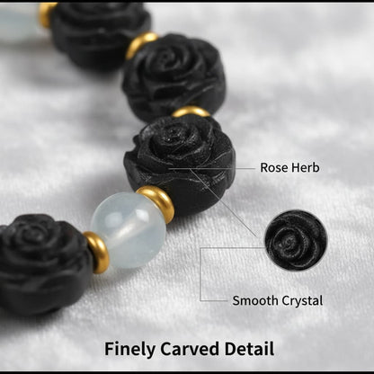 Macro detail shot of the handcrafted rose-shaped herbal beads on the Zhiji Rose Companion Bracelet, showing its natural texture.